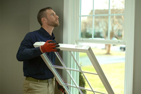 Man checking for window issues