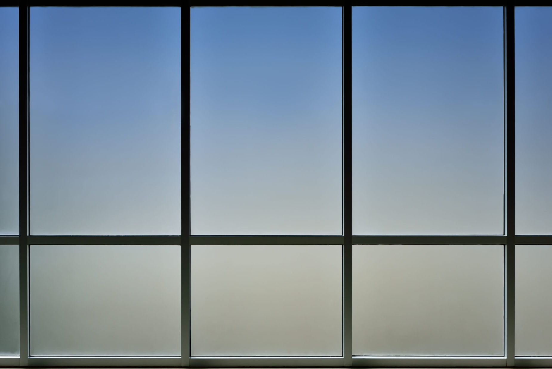 The,Glass,Window,Of,Building,With,White,Aluminum,Framework,,Blue