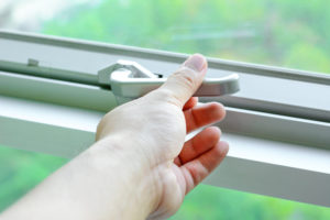 Hand grabbing awning window crank handle