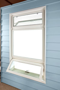 Top and bottom awning windows paired with fixed window