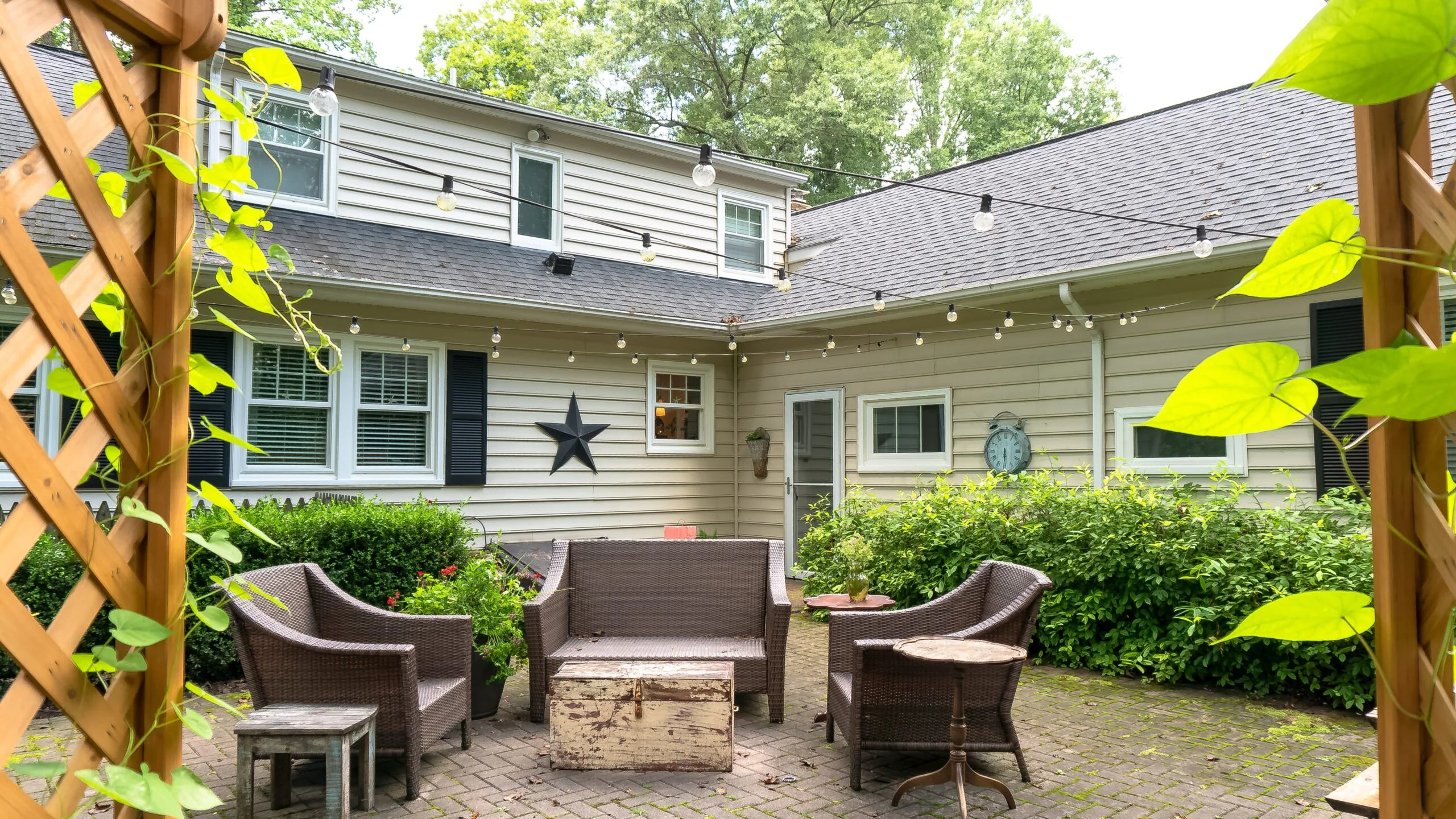 Garden Window, Beautiful garden area outside a home with beige vinyl siding